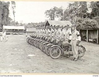 LAE, NEW GUINEA. 1944-09-21. MEMBERS OF THE NEW GUINEA FORCE PROVOST COMPANY MOTOR CYCLE PATROL ON PARADE. IDENTIFIED PERSONNEL ARE:- CORPORAL G.M. CAMERON (1); SERGEANT A.J. DENSMORE (2); CORPORAL ..