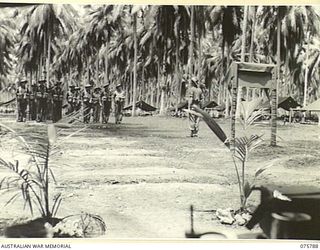 SIAR-NAGADA, NEW GUINEA. 1944-09-08. TROOPS OF D COMPANY, 61ST INFANTRY BATTALION "THE QUEENSLAND CAMERON HIGHLANDERS" RECEIVING DRILL INSTRUCTION ON THE UNIT PARADE GROUND IN PREPARATION FOR THEIR ..