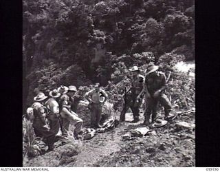 LALOKI VALLEY, NEW GUINEA. 1943-11-05. A PATROL FROM THE NEW GUINEA FORCE TRAINING SCHOOL (JUNGLE WING) ON AN EXERCISE NEAR THE ROUNA FALLS. SHOWN: Q18670 SERGEANT (SGT) L. F. CURRAN (1); VX50370 ..