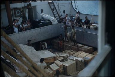 Unloading - note the police watching : Port Moresby, Papua New Guinea, 1953 / Terence and Margaret Spencer