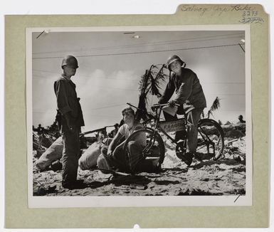 Photograph of Coast Guardsmen with Salvaged Japanese Bicycle