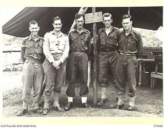 DUMPU, RAMU VALLEY, NEW GUINEA. 1944-02-09. THE STAFF CAPTAIN WITH MEMBERS OF THE ORDERLY ROOM STAFF OF THE 18TH INFANTRY BRIGADE HEADQUARTERS. IDENTIFIED PERSONNEL ARE:- QX43472 CORPORAL L.G. ..