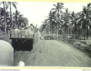 MILNE BAY, NEW GUINEA. SUPPLY TRUCKS