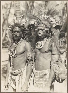 Types from Buna District [two men in head dresses] / Frank Hurley