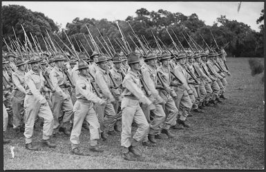 New Zealand soldiers march past the saluting base at the King's Parade, New Caledonia