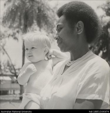 Fijian woman holding child