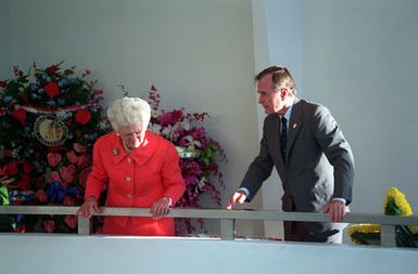 President George Bush and Mrs. Bush stand at the railing of the USS ARIZONA MEMORIAL as they look down at the sunken battleship USS ARIZONA during an observance commemorating the 50th anniversary of the Japanese attack on Pearl Harbor
