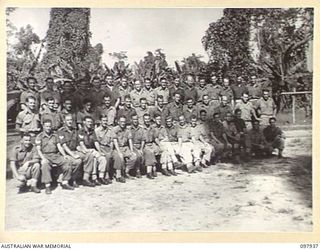 Torokina, Bougainville. 1945-10-12. Group portrait of the members of 22nd Battery, 2/11th Field Regiment photographed in the unit area. Left to right, back row: NX85608 Gunner (Gnr) W. G. Messer of ..