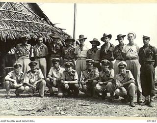 LAE, NEW GUINEA. 1944-04-01. NAVAL PERSONNEL AT HEADQUARTERS LAE RAN PORT DIRECTORATE. IDENTIFIED PERSONNEL ARE: O/N S8760 COOK J. DUNN (1); LIEUTENANT (SP) H.C. BROWN ROYAL AUSTRALIAN NAVAL ..