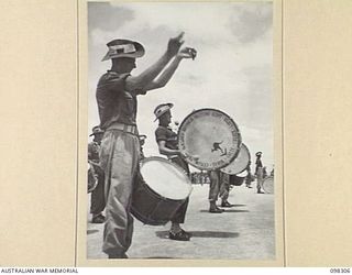 WEWAK, NEW GUINEA. 1945-10-26. A CEREMONIAL PARADE AND MARCH PAST BY 6 DIVISION WAS INSPECTED BY GENERAL SIR THOMAS A. BLAMEY, COMMANDER-IN-CHIEF, ALLIED LAND FORCES, SOUTH WEST PACIFIC AREA, AT ..