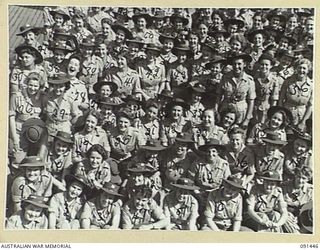 LAE, NEW GUINEA, 1945-05-07. SOME OF THE AUSTRALIAN WOMEN'S ARMY SERVICE WHO ARRIVED IN LAE FROM AUSTRALIA BY THE MV DUNTROON. THEY ARE EN ROUTE TO THE AUSTRALIAN WOMEN'S ARMY SERVICE BARRACKS AT ..