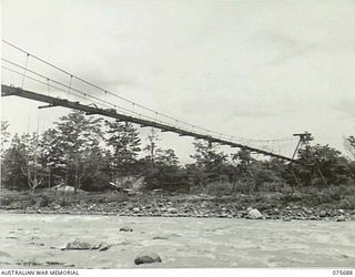 LAE, NEW GUINEA. 1944-09-08. THE NEW SUSPENSION BRIDGE BEING BUILT ACROSS THE BUSU RIVER BY TROOPS OF THE 20TH FIELD ENGINEERS