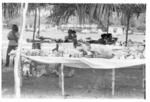 Food on tables under temporary shelter