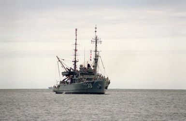 The salvage ship USS CONSERVER (ARS-39) approaches the entrance to the channel as it arrives for a visit to Naval Station, Pearl Harbor, Hawaii.