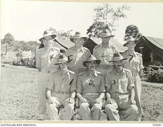 LAE, NEW GUINEA. 1944-11-16. OFFICERS OF THE DISTRICTS ACCOUNTS OFFICE, ARMY PAY CORPS. IDENTIFIED PERSONNEL ARE: VX108201 CAPTAIN J.F. HUGHES (1), SX16834 MAJOR H.S. DAULBY (2), VX133296 ..