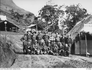 DUMPU, NEW GUINEA. 1944-04-20. SIGNAL OFFICE STAFF BESIDE THE UNIT SIGNAL OFFICE AT HEADQUARTERS 15TH INFANTRY BRIGADE. IDENTIFIED PERSONNEL ARE:- V310552 SIGNALMAN V. GILBERT (1); VX137586 ..