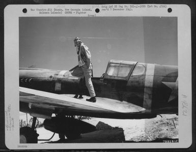 Lt. K.M. Nzus, Of Erskine, Minn., Fighter Pilot With The 44Th Fighter Squadron, Is Shown As He Prepares To Get Into His Curtiss P-40 For A Mission To Munda, New Georgia Island, Solomon Islands. 14 August 1943. (U.S. Air Force Number 79818AC)