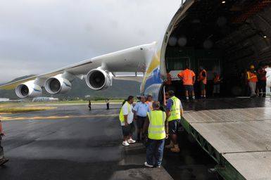 Earthquake ^ Flooding ^ Tsunami - Pago Pago, American Samoa, October 13, 2009 -- Logistics workers in American Samoa strategize how they will unload generators from a Antonov AN-225 cargo plane. The cargo plane is the largest fixed wing aircraft in the world and carried generators contracted by the Federal Emergency Management Agency to assist the island with electrical power restoration. David Gonzalez/FEMA