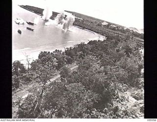 HANSA BAY, NEW GUINEA. 1943-08-28. FOURTH OF A SERIES OF FIVE GRAPHIC PHOTOGRAPHS TAKEN FROM A RAAF PLANE DURING THE BOMBING OF JAPANESE SUPPLY CRAFT, ILLUSTRATING THE CONSEQUENCES OF FOLLOWING A ..