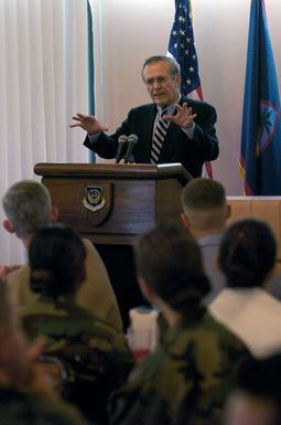 The Honorable Donald H. Rumsfeld, U.S. Secretary of Defense, answers a question from the audience at a town hall meeting in the Magellan Hall Dining Facility at Andersen Air Force Base, Guam on Nov. 14, 2003. (DoD photo by TECH. SGT. Andy Dunaway) (Released)