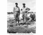 CAPT. Thomas H. Hederman and CAPT. Roy W. Lajeunesse watching enlisted men's softball game, probably on Bikini Island, summer 1947