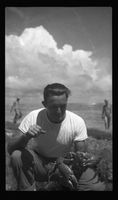 [Serviceman holding crab]