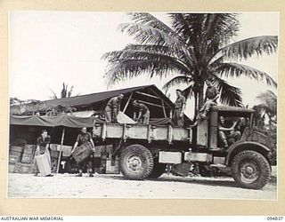 JACQUINOT BAY, NEW BRITAIN, 1945-08-08. PERSONNEL OF ASSISTANCE DIRECTOR OF ORDNANCE SERVICE, 5 DIVISION, AT WORK PRIOR TO THEIR DEPARTURE FROM THE ISLAND AFTER BEING RELIEVED BY 11 DIVISION