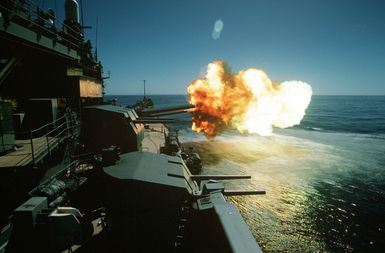 The battleship USS MISSOURI (BB-63) fires one of its Mark 7 16-inch/50-caliber guns during exercise RIMPAC '90 near Hawaii