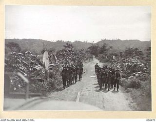 MALAGUNA, RABAUL AREA, NEW BRITAIN, 1945-09-10. TROOPS OF 4 INFANTRY BRIGADE, WHO OCCUPIED RABAUL AFTER THE JAPANESE SURRENDER, MARCHING ALONG MALAGUNA ROAD TOWARDS THE TOWNSHIP