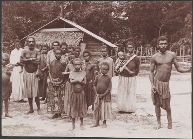 A group of villagers standing in front of a building in Loh, Torres Islands, 1906 / J.W. Beattie