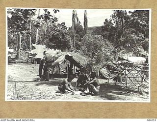 GOALING RIVER, NEW GUINEA. 1944-01-21. A SECTION OF THE LINES OF "A" COMPANY, PAPUAN INFANTRY BATTALION AT THE MOUTH OF THE RIVER. THIS COMPANY HAS BEEN IN ACTION AT NASSAU BAY, TAMBU, SALAMAUA, ..