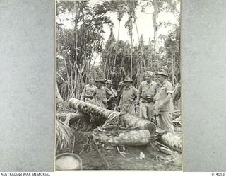 1943-01-14. LIEUT. GENERAL R.L. EICHELBERGER AND GENERAL SIR THOMAS BLAMEY INSPECT A JAP PILLBOX NEAR BUNA. IT'S RESISTANCE PARTIALLY OVERCOME BY TANKS, THE PILLBOX WAS SILENCED BY ALLIED TROOPS ..