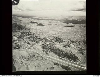 KILA KILA, PORT MORESBY, PAPUA. C. 1943. AERIAL VIEW OF KILA KILA AIR FIELD, LOOKING NORTH WEST TOWARDS WARDS STRIP AIRFIELD