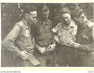 DUMPU, RAMU VALLEY, NEW GUINEA, 1944-02-11. VX48332 MAJOR W.F. BARKER (1) THE OFFICER COMMANDING "B" COMPANY, 57/60TH INFANTRY BATTALION, GIVING ORDERS TO HIS OFFICERS. IDENTIFIED PERSONNEL ARE: ..