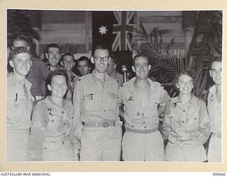 TOROKINA, BOUGAINVILLE. 1945-04-16. NEW ZEALAND YMCA REPRESENTATIVES WITH TWO AUSTRALIAN ARMY MEDICAL WOMEN'S SERVICE MEMBERS FROM THE 2/1 GENERAL HOSPITAL AT THE DANCE HELD IN THE OTHER RANKS ..