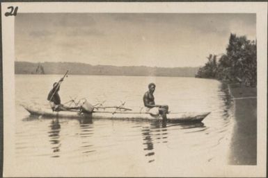 Two men in a canoe, Blanche Bay, New Britain Island, Papua New Guinea, approximately 1916