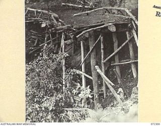 YAULA, NEW GUINEA. 1944-04-11. ONE OF THE BRIDGES ALONG THE BOGADJIM ROAD WHICH THE JAPANESE SUCCEEDED IN DESTROYING DURING THEIR RETREAT FROM THE 57/60TH INFANTRY BATTALION. THE DESTRUCTION OF THE ..