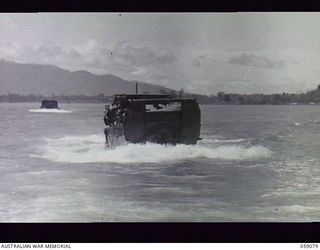 LAE, NEW GUINEA. 1943-10-17. BARGE CONVOY (TILLEY FORCE) OF THE 29/46TH AUSTRALIAN INFANTRY BATTALION. ONE PLATOON PROCEEDED TO BUKAUA AND THE REMAINDER PROCEEDED TO MONGI RIVER TO CLEAR THE ..