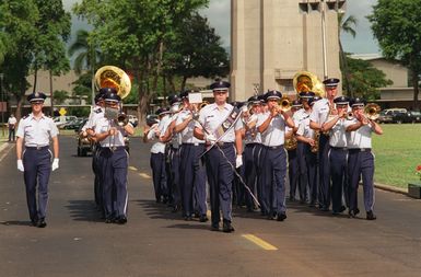 The USAF Pacific Armed Forces Band marches and plays during the Pacific Air Force Change of Command ceremony. GEN. Robert L. Rutherford relinquishes the Pacific Command to General John G. Lorber