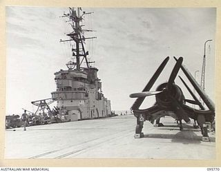 AT SEA OFF RABAUL, NEW BRITAIN. 1945-09-06. CORSAIR AIRCRAFT ON FLIGHT DECK OF THE AIRCRAFT CARRIER HMS GLORY. THE CORSAIRS PROVIDED AIR COVER DURING THE SIGNING OF THE INSTRUMENT OF SURRENDER. THE ..