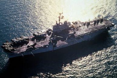 A port bow view of the amphibious assault ship USS GUAM (LPH-9) underway during Operation Desert Shield