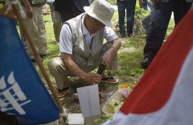 Twenty-seven Japanese veterans from tank units stationed on the neighboring island of Saipan during World War II (WWII) came to pay respects to fallen comrades during a 60th Anniversary reunion. These veterans had family and friends stationed on Guam, and they didn't learn of their fates for years following the war. They came today with their families to place flowers, burn incense, light candles and give prayers at Tarague Beach a sight of major conflict during the war. The Japanese tank units at Tarague were the last enemy tanks on Guam and with their destruction by the United States Marine Corp (USMC) all organized resistance on Guam had ended