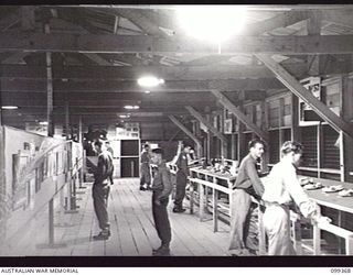 TOROKINA, BOUGAINVILLE, 1945-12-07. THE MODELLING AND COOKING SECTION AT THE ARTS AND CRAFTS EXHIBITION HELD AT TOROKINA. MANY OF THE ENTRANTS ARE STUDENTS AT THE TOROKINA REHABILITATION CENTRE