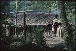 Boy in front of house