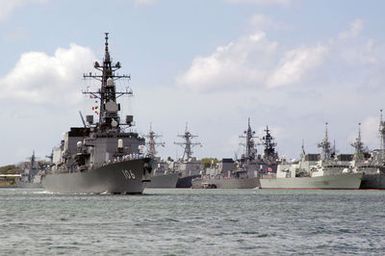 A starboard bow view of the Japanese Maritime Self Defense Force (JMSDF) Murasame Class Destroyer SAMIDIRE (D 106) (left), underway exiting the harbor at Navy Base (NB) Pearl Harbor, Hawaii (HI) for the start of the Rim of the Pacific (RIMPAC) 2006 Exercises. RIMPAC is the largest biennial maritime exercise, which brings together military forces from Australia, Canada, Chile, Peru, Japan, the Republic of Korea, the United Kingdom and the US