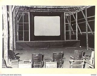 YALU, NEW GUINEA. 1945-08-03. THE INTERIOR OF THE SCHOOL THEATRE AT THE NEW GUINEA TRAINING SCHOOL. IT MEASURES 100 FEET BY 20 FEET AND HAS SEATING ACCOMMODATION FOR 400