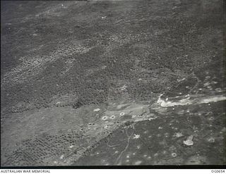 ALEXISHAFEN, NEW GUINEA. 1944-02-27. AERIAL PHOTOGRAPH OF BOMB CRATERS ON THE JAPANESE-HELD AIRSTRIP ON THE NORTH COAST OF NEW GUINEA AFTER AN AIR RAID BY VULTEE VENGEANCE DIVE BOMBER AIRCRAFT OF ..