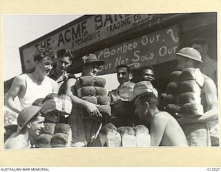WITH THE A.I.F AT PORT MORESBY. BREAD ZONING RAISES NO PROBLEMS AT THE CHIEF BAKERY - IT IS WORKED ON A FETCH AND CARRY BASIS. THIS ESTABLISHMENT IS NOT KNOWN AS "THE BOMB BATTY BAKERS" AS IT WAS ..