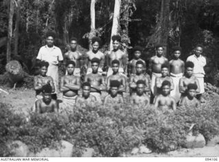 POPONDETTA, NEW GUINEA, 1945-07-02. A GROUP OF NATIVE MEDICAL ORDERLIES OF THE ANGAU NATIVE HOSPITAL. THEIR DISPOSITION WITHIN THE HOSPITAL IS TWO TO EACH WARD