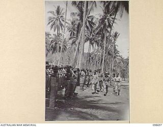 MALAGUNA, NEW BRITAIN. 1945-11-06. LIEUTENANT GENERAL V.A.H. STURDEE, GENERAL OFFICER COMMANDING FIRST ARMY (1), ACCOMPANIED BY MAJOR GENERAL K.W. EATHER, GENERAL OFFICER COMMANDING 11 DIVISION (2) ..